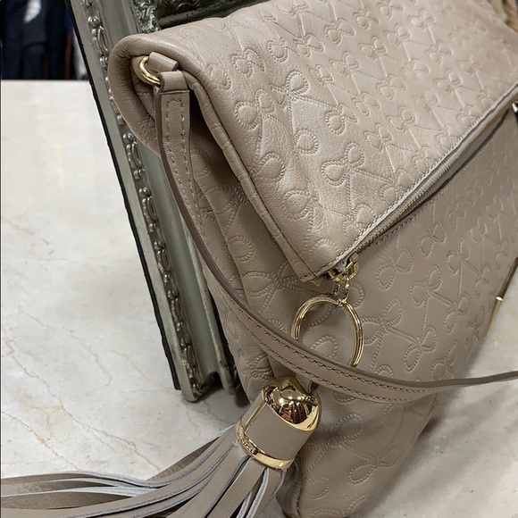 ANYA HINDMARCH LEATHER SIGNATURE EMBOSSED BOWS CROSSBODY BAG IN TAUPE - Picture 12 of 14